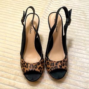 Strappy leopard peep toe heels.